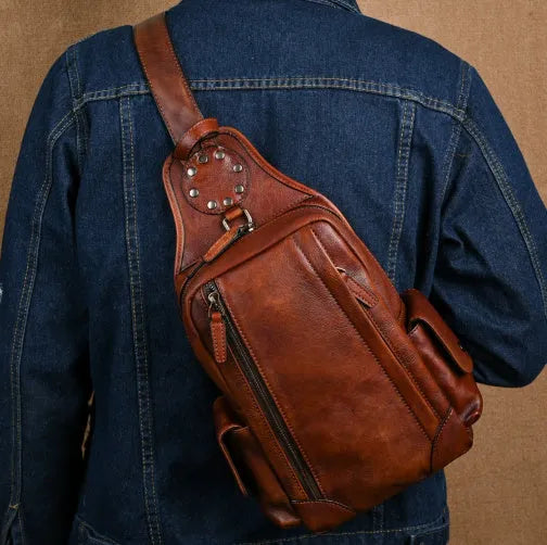 Men's genuine leather chest crossbody messenger bag, 11 inch, in light brown or black with polyester cotton lining.