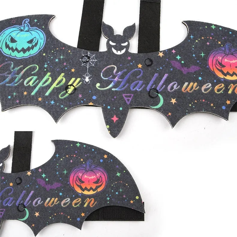 Halloween batwing cloak costume for a cat, made from black and orange felt.