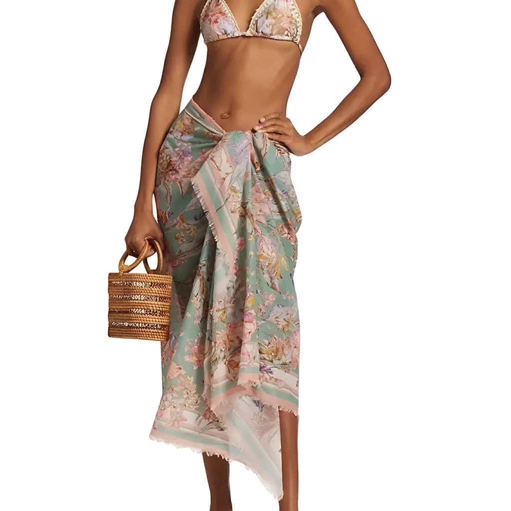 Women's floral bikini swimsuit set with top, briefs, and skirt in creamy-white beige colour