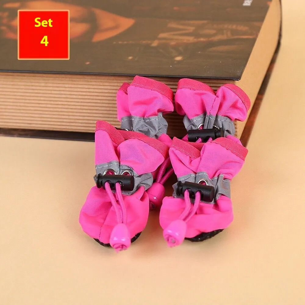 Cloth dog shoes with soft soles in multiple colours including red, black, blue, and monkey print designs