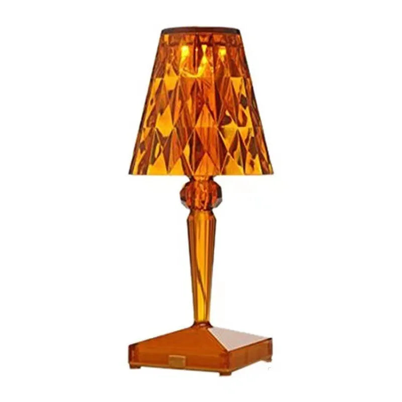 Rose gold portable touch-control projection night light on a tabletop