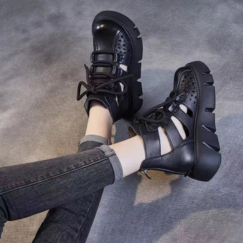Women's black platform sandals with hollow hole design and fish-mouth toe, made from soft cowhide leather.