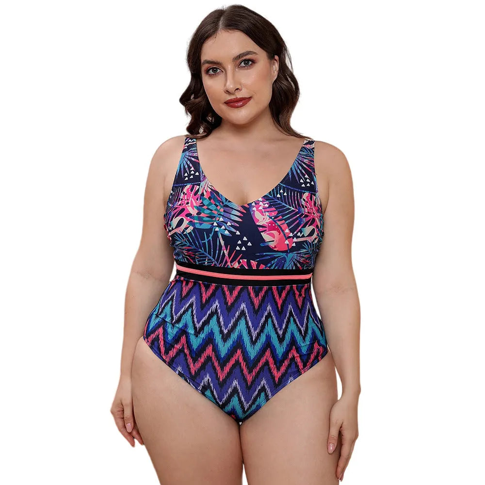 Blue printed one-piece swimsuit with spaghetti straps on a model, showing striped vest design.