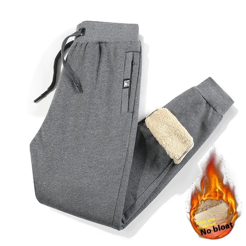 Men's grey fleece-lined cotton track pants with drawstring waistband in oversized fit