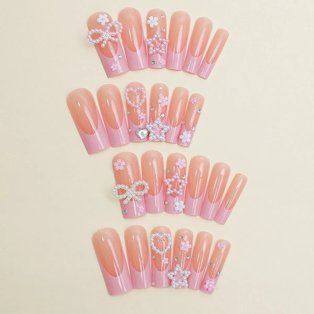 Water transfer nail art stickers with long pipe and bow design next to a plastic armour suit applicator.