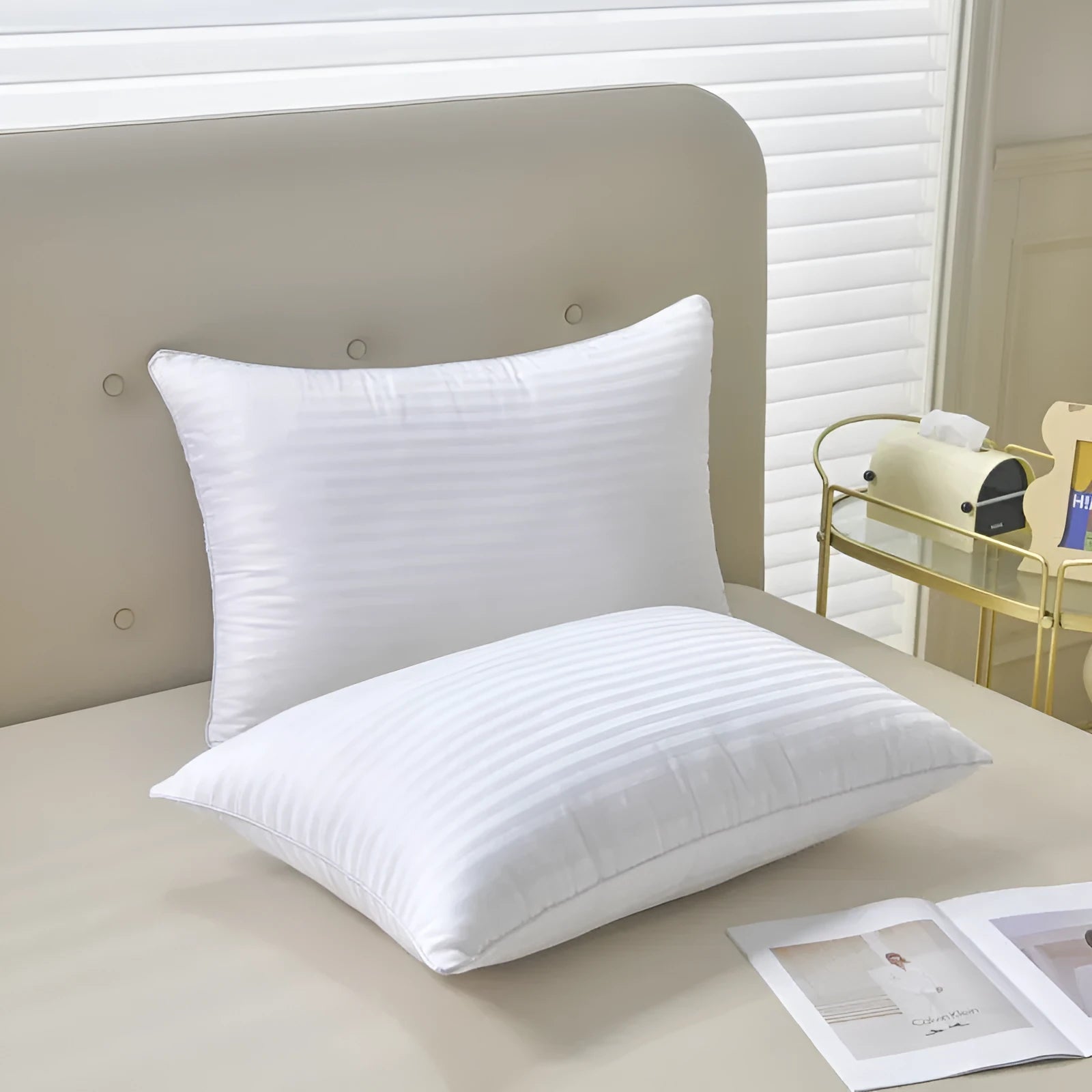 White cotton satin stripe pillow with feather and cotton filling, shown in low, medium, and high loft options.