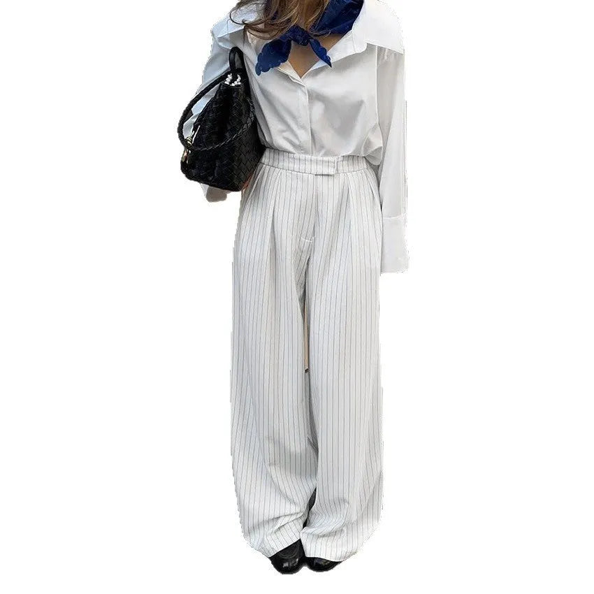 White striped wide-leg trousers with zipper details on polyester fabric for office commuting