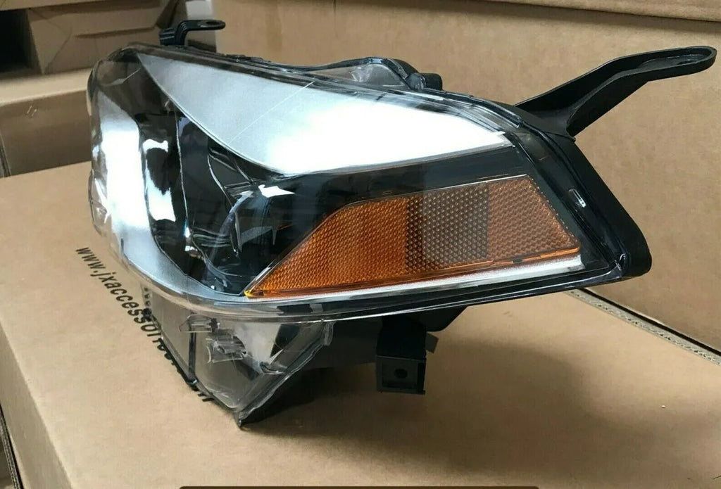 Pair of halogen headlight assemblies for Toyota Corolla with clear lens and black housing trim