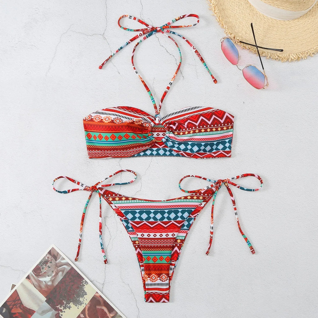 Women's green striped bikini with orange grid pattern showing halter neck and high-waist briefs