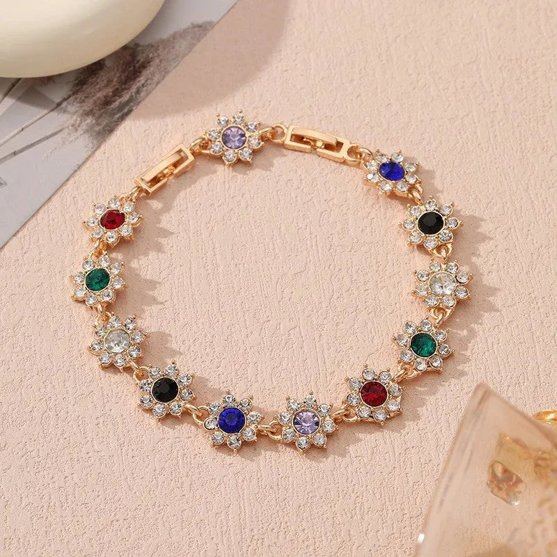 Flower-shaped zinc alloy bracelet with electroplated finish and coloured gem accents