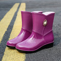 Women's low tube PVC rain boot in beige colour with non-slip sole.