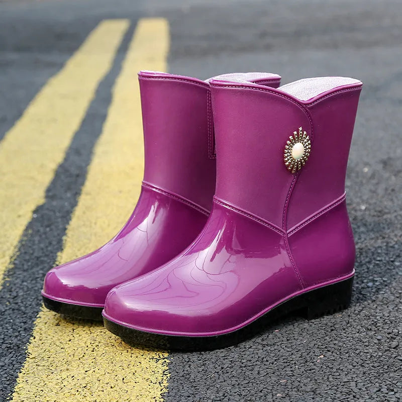 Women's low tube PVC rain boot in beige colour with non-slip sole.