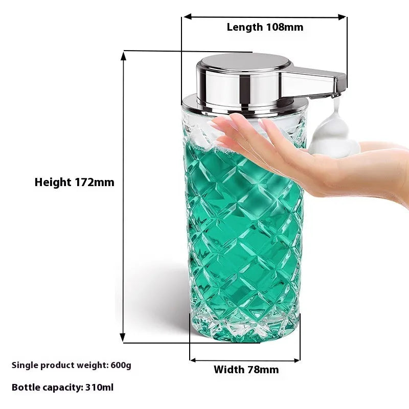 Silver automatic sensor soap dispenser with USB-C charging port on a bathroom counter.