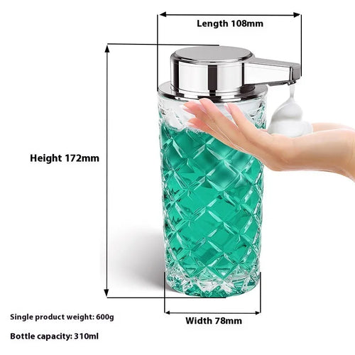 Silver automatic sensor soap dispenser with USB-C charging port on a bathroom counter.
