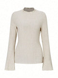 Long sleeve slim fit polyester top with lantern sleeves in black colour, showing round neck design