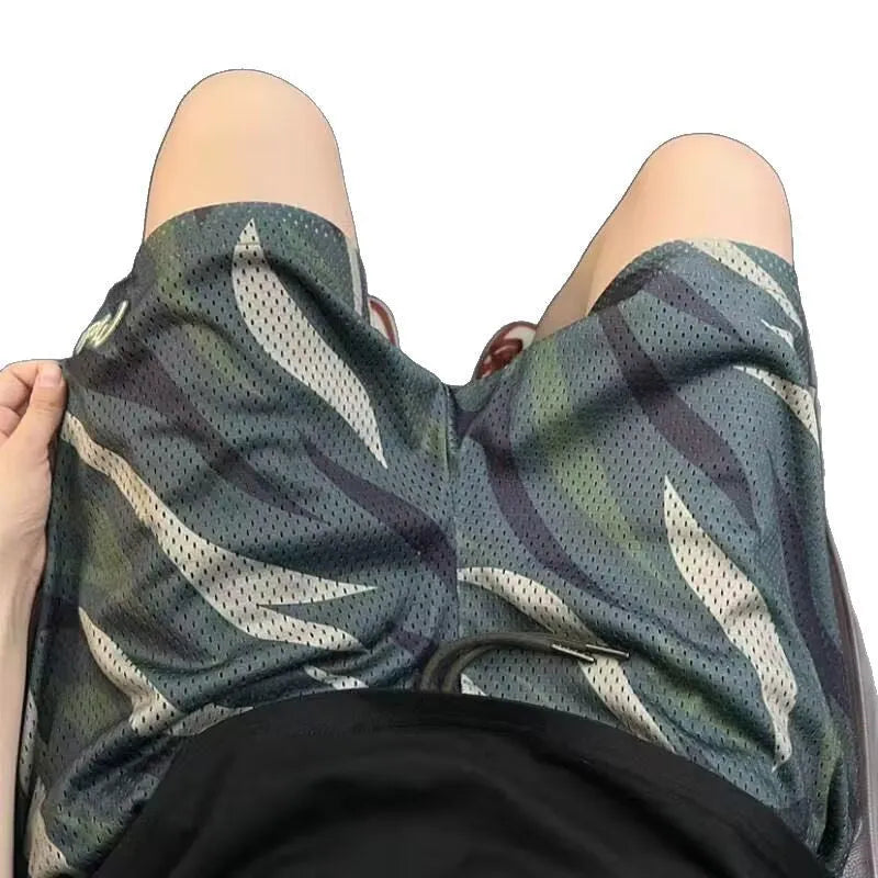 Men's camouflage pattern straight-leg mesh shorts on a plain background