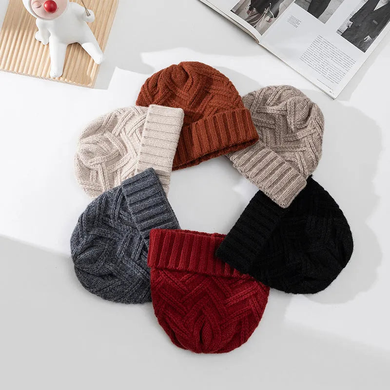 Wool knitted dome crown beanie in six colour options with totem pattern detail