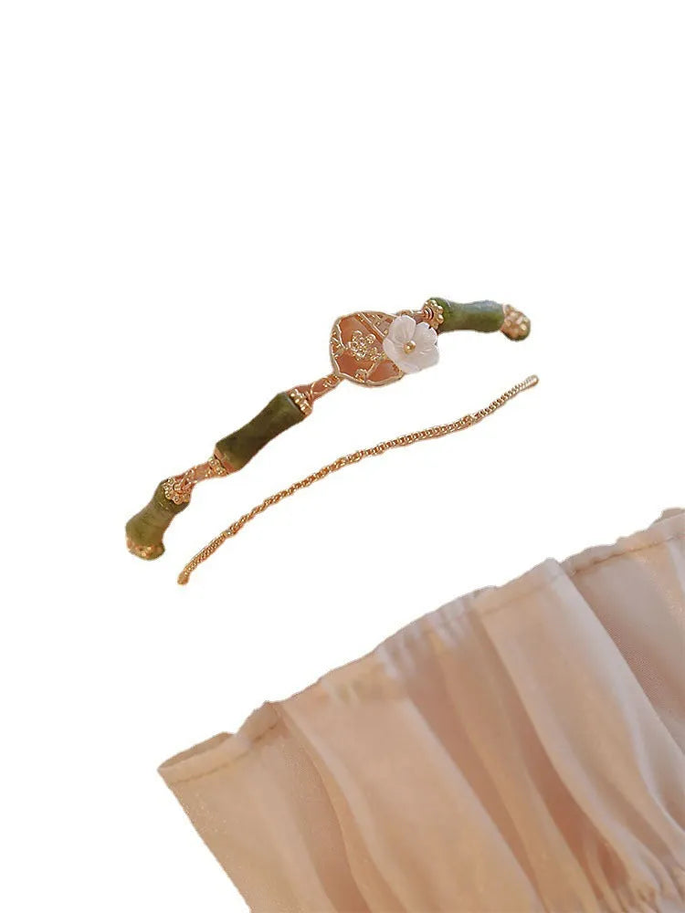 Handmade natural olivine stone bracelet with double layer twin bells of Ireland design.