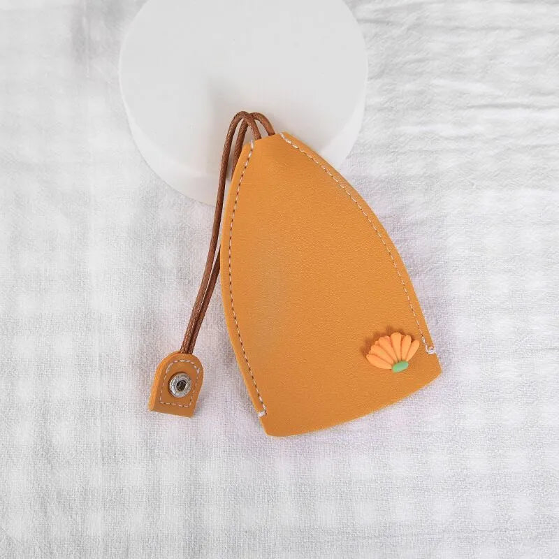 Cartoon PU leather pull-out car key case measuring 14 x 7.5cm with colourful designs