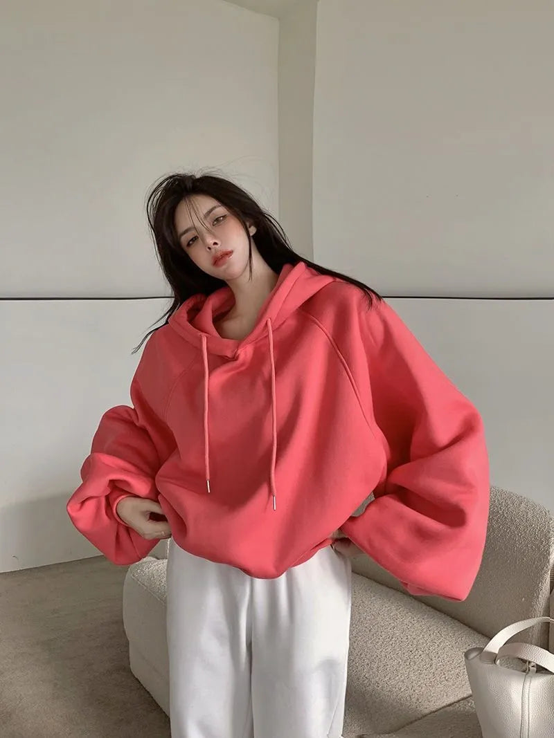 Watermelon red sleeveless Mulberry Silk hooded sweater on a hanger, showing loose fit and solid colour.