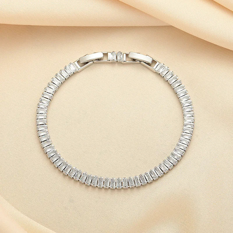 Women's brass bracelet with zircon inlaid geometric quadrilateral design in champagne gold finish
