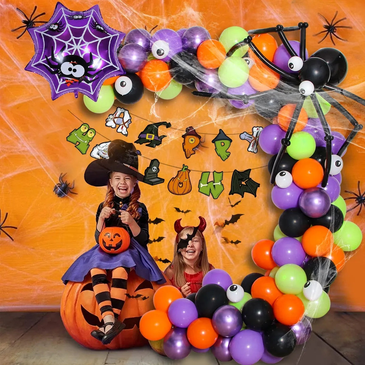 Halloween spider balloon arch with skull and pumpkin designs in black and white colours