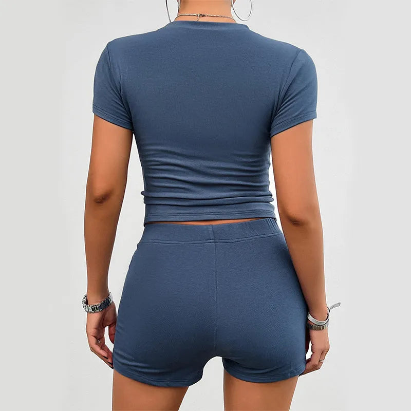 Women's solid colour viscose sports set with short sleeve t-shirt and elastic waist shorts.