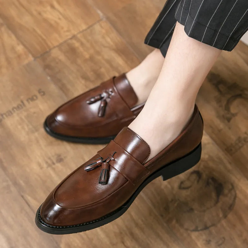Men's black slip-on business casual shoes with tassel detail and rubber soles