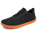 Men's low-top casual walking shoes in black with Flyknit upper, round wide toe, and rubber sole.
