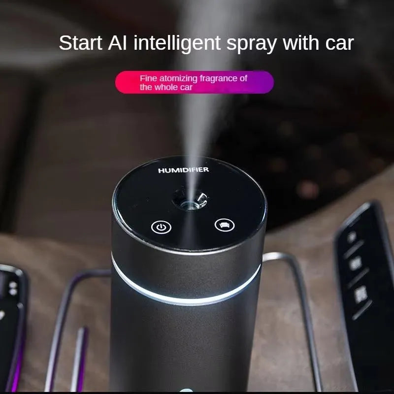 Black aluminium car humidifier and essential oil diffuser with night light on a desk.