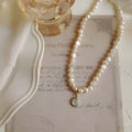 Adjustable vintage pearl necklace with geometric alloy pendant, chain length 21-50cm