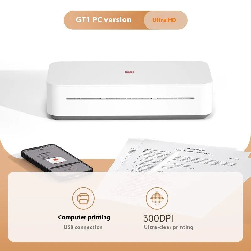 Small white plastic intelligent remote learning printer with thermal ribbon cartridge on a desk.