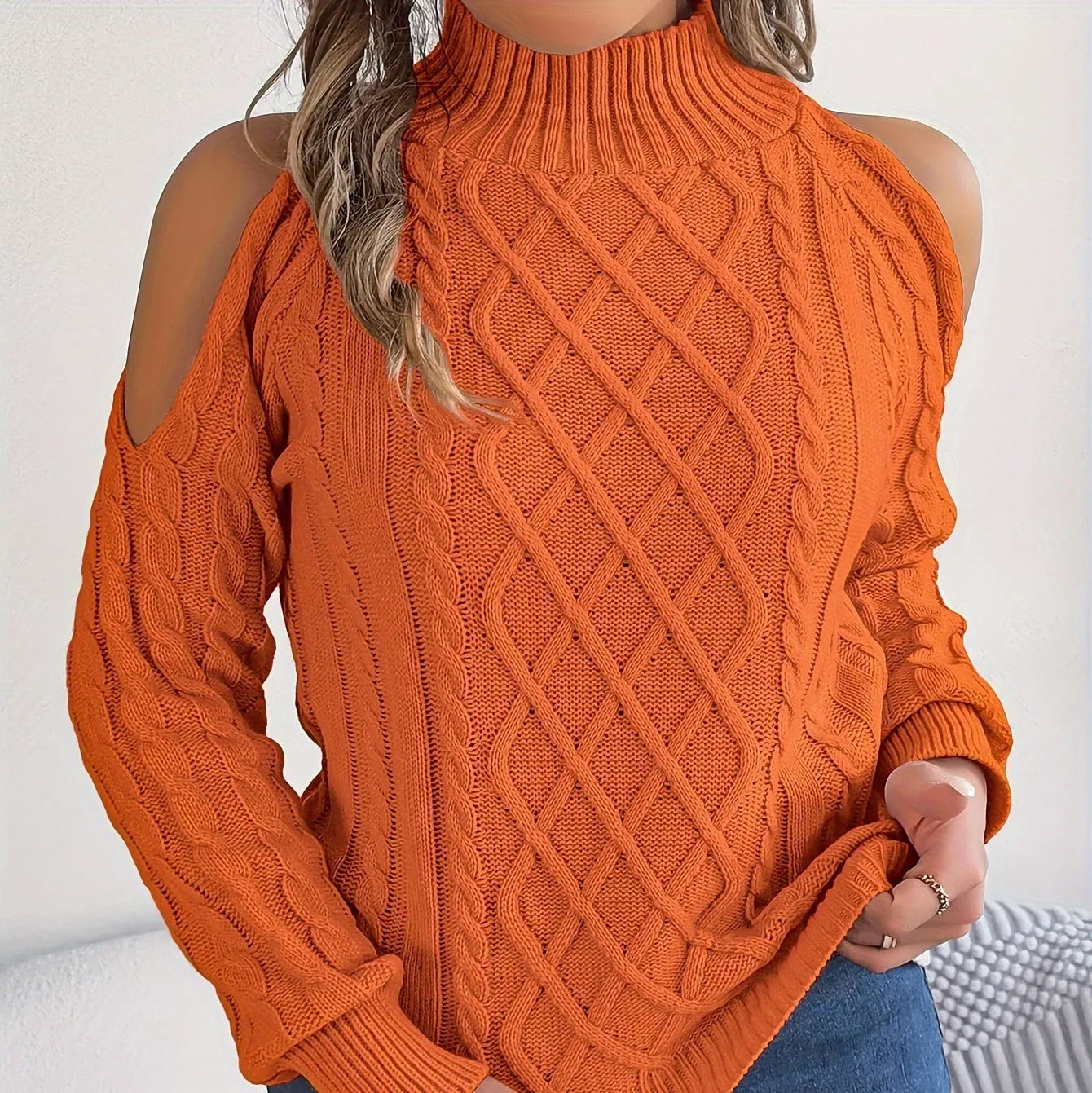 Women's gray strapless acrylic sweater with twisted pattern, half-high collar, and long lantern sleeves.