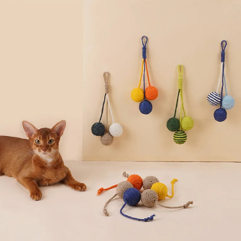 Cat teaser stick toy set with four bite-resistant elements including catnip balls in blue, green, red, yellow colours.