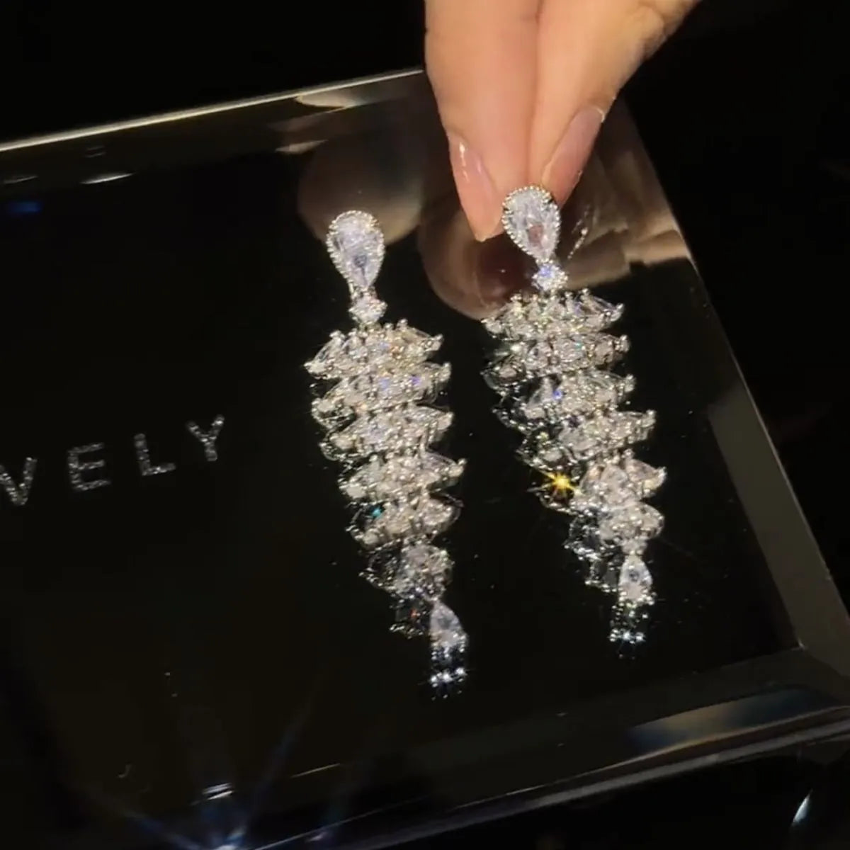 Silver pagoda coloured drop earrings with a sparkling zircon Christmas tree design on copper studs.
