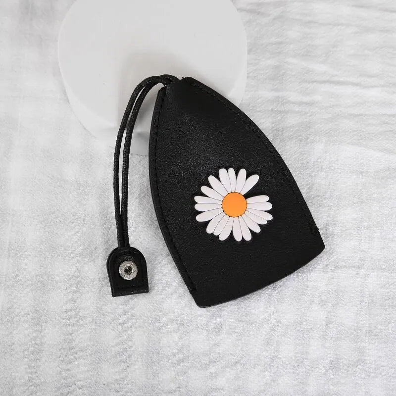 Cartoon PU leather pull-out car key case measuring 14 x 7.5cm with colourful designs