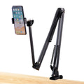 Black foldable metal cantilever bracket holding a tablet on a desk.