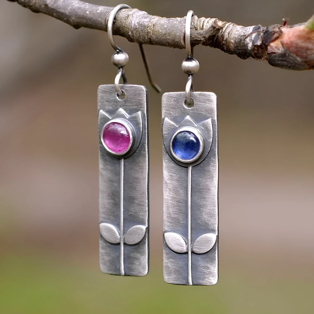 Antique finish red sapphire earrings with geometric oval shape and electroplated metal construction