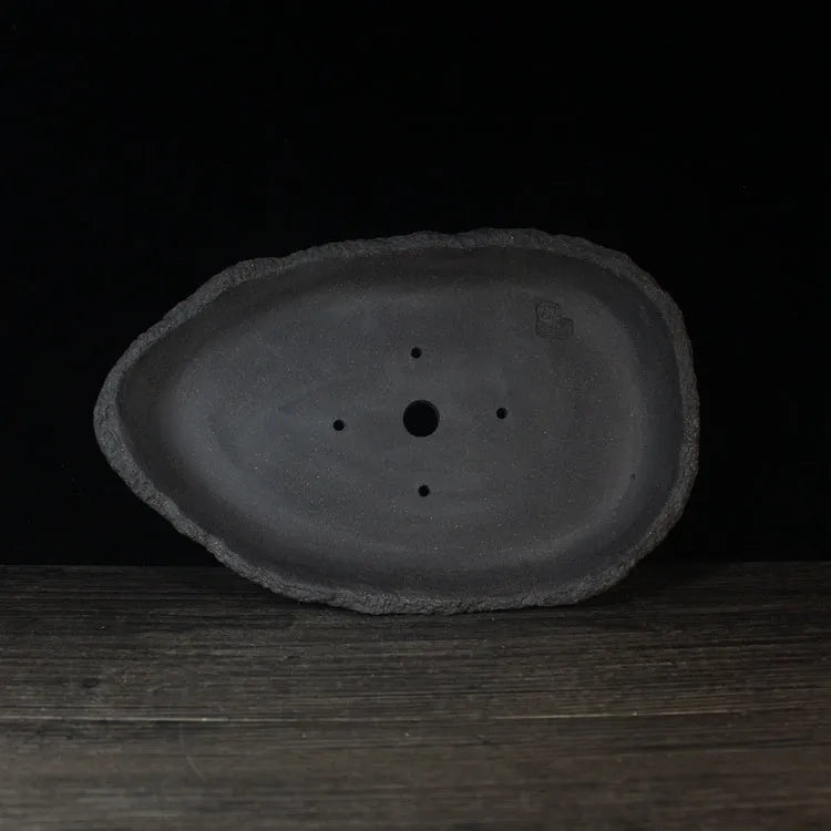 Handmade purple clay flower pot showing traditional craftsmanship and floor-standing design