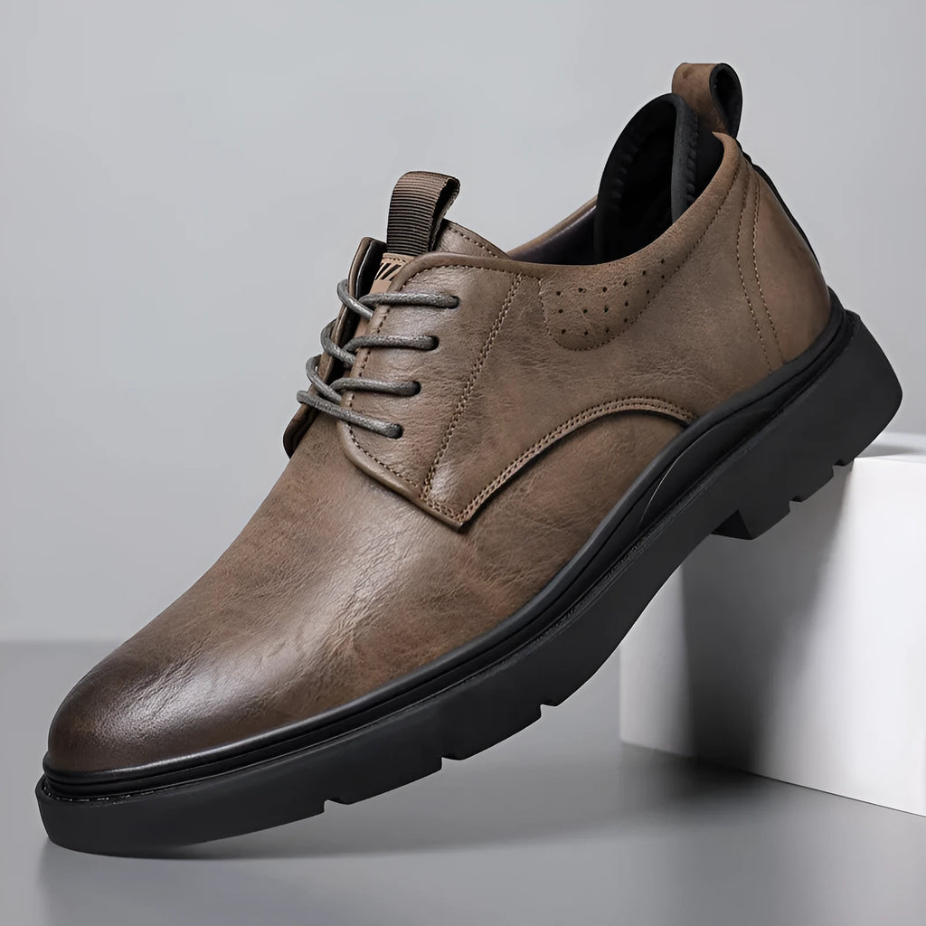 Men's black leather sneakers with rubber sole and sewing line detailing on two-layer cowhide upper