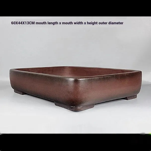 Handmade antique rectangular purple clay flower pot showing traditional finish