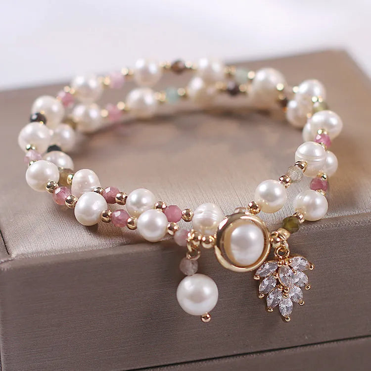 Double-layer strawberry quartz bracelet with lucky cat charm and red cat's eye flowers on adjustable fastening