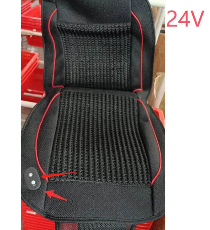 Black car ventilation massage seat cushion with power cord on vehicle seat