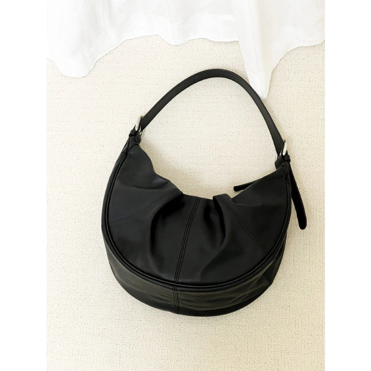 Women's genuine leather shoulder bag with dumpling shape and cowhide texture in black colour