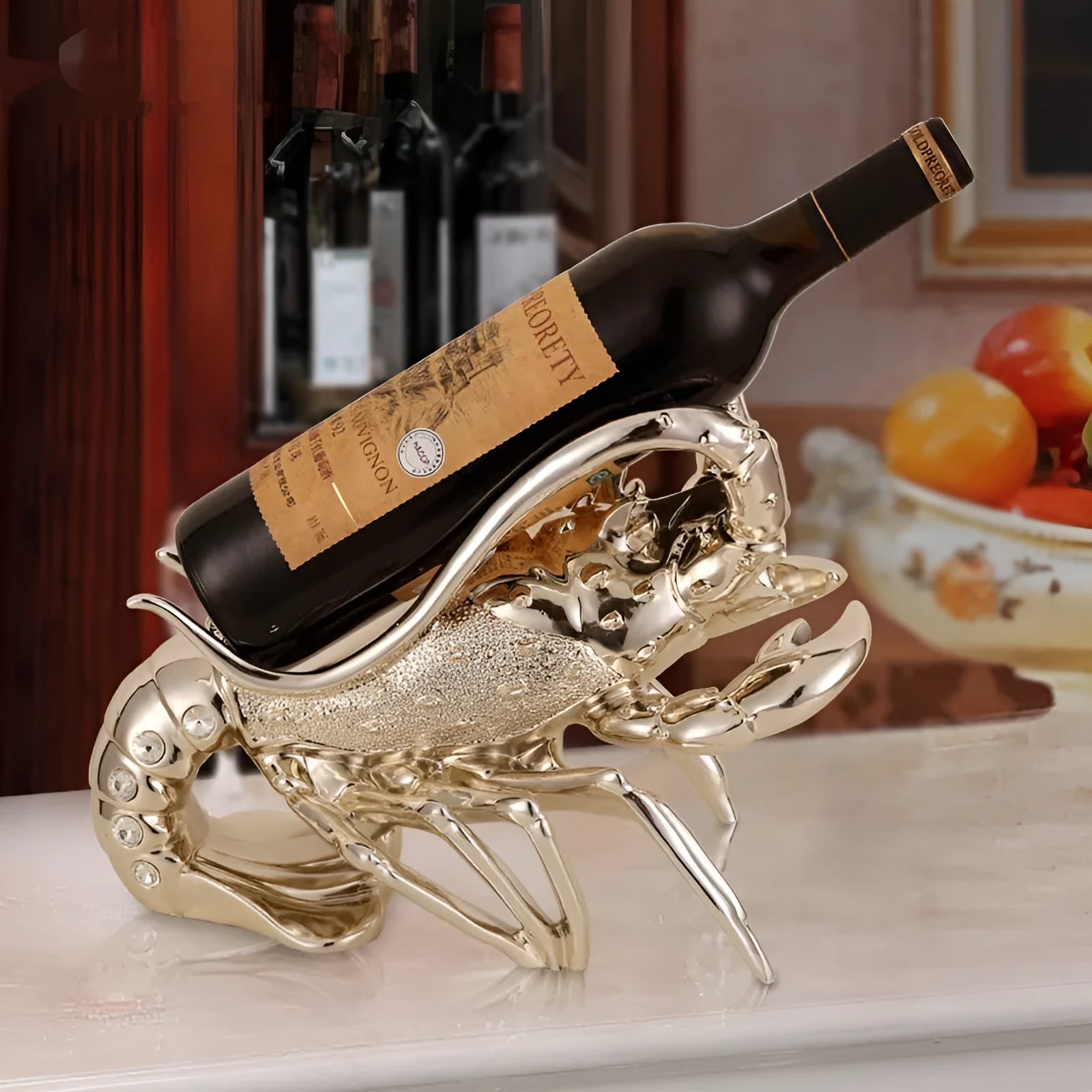 Lobster-shaped wine rack ornament in metallic rose gold or silver finish on display surface