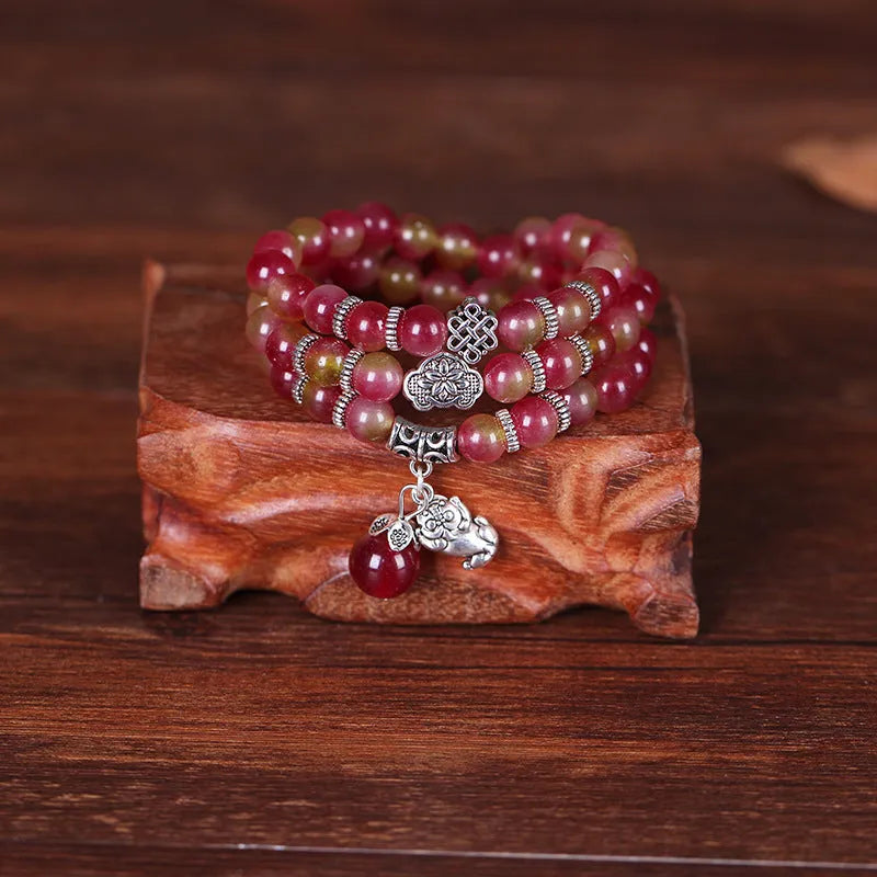 Handmade watermelon crystal bracelet with Chinese knot and elephant beads in 6mm or 8mm size.