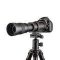 420-800mm manual telephoto zoom camera lens with T-mount adapter ring on a table