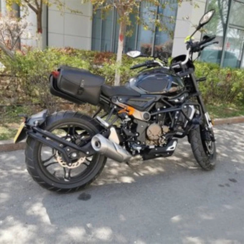Black PU leather motorcycle swingarm saddlebag mounted on a Harley-Davidson Sportster.
