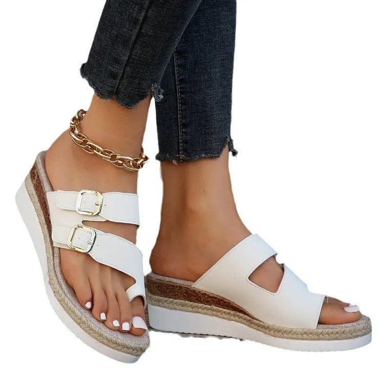 White woven patent leather women's wedge sandals with a peep toe and finger-fit strap design.