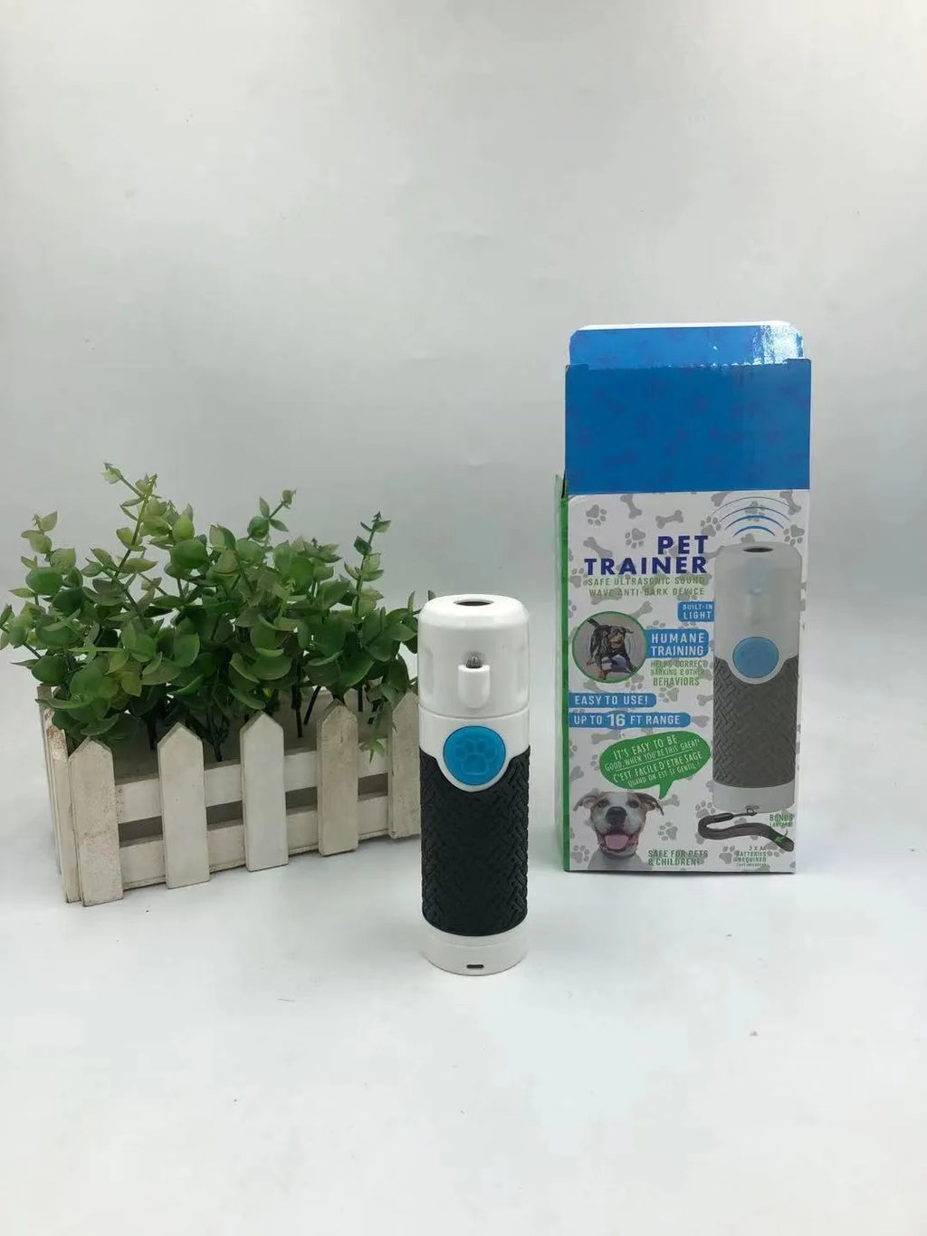 White ultrasonic handheld dog trainer for bark control with ABS plastic construction